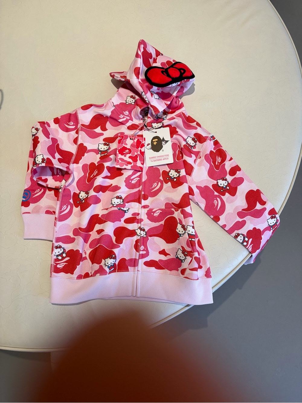 BAPE X Sanrio Hello Kitty Pink Camo Zip Hoodie with Bow Hood (size 110, 4T-5T)